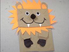 a paper bag with an image of a lion on it's face and feet