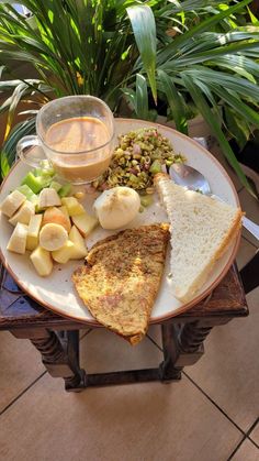 a white plate topped with toast, fruit and nuts