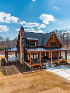 a large house with a stone chimney and metal roof