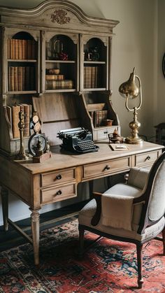 an old fashioned desk with a bookcase and chair