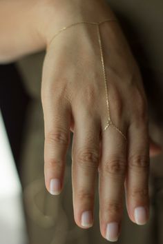 14K Gold Hand Chain / Minimalist Hand Bracelet/Shahmaran 14K Gold Sahmeran Bracelet Hand Bracelet include 1 cm extension ring Weight:~1,10-1,15  gr Made by 14K - 585  solid gold chain.  It's not plated or vermeil gold Free Fedex express shipping in 2-7 business days. Please measure your wrist dimension as instructed at 2th photo. Don't put extra measure on exact wrist circumference size. We find the required size by making the necessary addition on your wrist circumference measurement. so don't Gold Hand Chain, Finger Bracelets, Hand Chain Bracelet, Pretty Jewelry Necklaces, Ring Bracelet Chain, Hand Bracelet, Solid Gold Chains, Gold Hand, Hand Chain