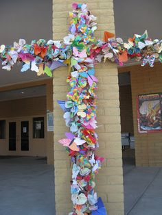 a cross made out of paper and other items