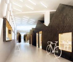 a bike is parked in the hallway between two walls