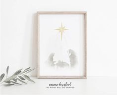 a framed christmas card with an image of two people under a star on the top