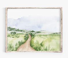 a watercolor painting of a dirt road in the middle of a green field with trees