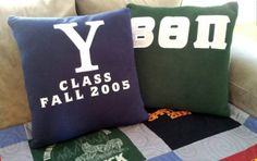 two pillows that say y and class fall 2009 on them sitting on a couch next to each other