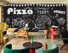 a pizza restaurant with chalkboard wall and chairs