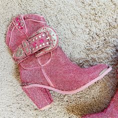 Used Once. Good Condition But A Few Rhinestones Fell Off. You Can’t Really Tell Unless You Look Very Closely. Pink Synthetic Upper Rubber Sole 3" Heel Size 7m Belt Removable Covered In Pink Rhinestones Beautiful Shoes! You Will Get Lots Of Compliments Embellished Pink Boots For Evening, Luxury Round Toe Boots With Bling, Embellished Pink Evening Boots, Luxury Pink Party Boots, Pink Glitter Cowgirl Boots, Pink Sparkly Boots, Pink Rhinestone Cowboy Boots, Embellished Pink High Heel Boots, Pink Fitted Western Heeled Boots