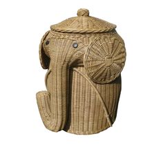 an elephant shaped wicker basket with lid