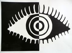 an eye is shown in black and white on a piece of paper that has been cut out