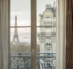 an open window overlooking the eiffel tower in paris