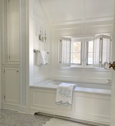 a bath room with a tub and a window