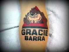 a tattoo with the words gracie barra on it and an angry gorilla