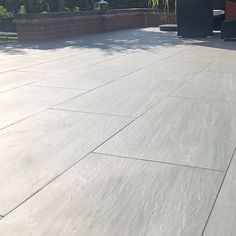 a person riding a skateboard on top of a cement surface