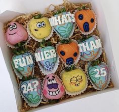 an open box filled with decorated cookies in the shape of animals and words that say fun water