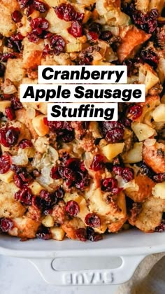 a casserole dish filled with stuffing and cranberries