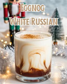 ￼  A creamy Eggnog White Russian in a rocks glass with layers of eggnog and coffee liqueur, topped with a sprinkle of nutmeg, set against a blurred Nutcracker-inspired Christmas backdrop.  Ingredients:  1 oz vodka 1 oz coffee liqueur (such as Kahlúa) 2 oz eggnog (store-bought or homemade) Ground nutmeg or cinnamon (for garnish) Ice  Instructions:  Prepare the Glass: Fill a rocks glass with ice.  Mix the Spirits: Pour in 1 oz vodka and 1 oz coffee liqueur over the ice.  Add Eggnog: Slowly pour 2 oz eggnog over the vodka and coffee liqueur, letting it swirl together for a creamy effect.  Garnish: Sprinkle a pinch of ground nutmeg or cinnamon on top for a holiday finish.  Serve: Give it a light stir if desired and enjoy your festive Eggnog White Russian! Eggnog Recipe With Alcohol, Eggnog White Russian, Smoothie Shots, Egg Nogg, White Russian Recipe, Vacation Drinks, Alcoholic Eggnog, Blended Coffee Recipes, Eggnog Drinks