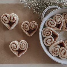 cinnamon rolls arranged in the shape of hearts