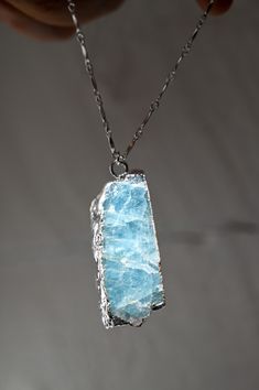 We all need a crystal pendant necklace like this stunning Aquamarine necklace! Not only can it be worn day to day but it can also be a statement piece for going out, layered with other Fierce Forward jewels. Aquamarine carries properties of flow, fluidity, and trust. Wear your I Trust My Path Necklace and remember to trust yourself and the path you're on! This necklace goes well with a pair of statement earrings, like the I Am Crystal Clear Arrowhead Earrings model wears in images. Aquamarine ge Luxury Silver Glass Necklace, Arrowhead Earrings, Earrings Model, Aquamarine Necklace, Handmade Jewelry Tutorials, Crystal Pendant Necklace, I Trust, Mala Necklace, Aquamarine Gemstone