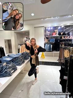 two beautiful women standing next to each other in a clothing store