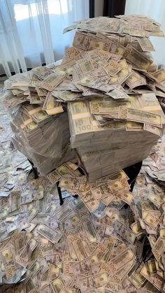 a pile of money sitting on top of a table