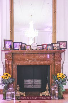 the fireplace is decorated with sunflowers and vases on it's mantle