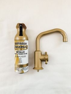 a faucet next to a bottle of rustoleum on a white background