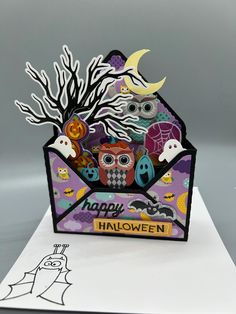 a card with an envelope that says happy halloween on it and owls in the background