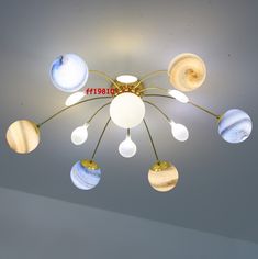 a chandelier hanging from the ceiling in a room