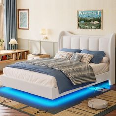 a bed with blue lights underneath it in a room next to a rug and lamp