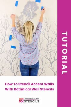 a woman is painting a wall with blue tape and pink lettering that says how to stencil accent walls with botanical wall steils