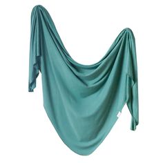 a green draped cloth is hanging on the wall