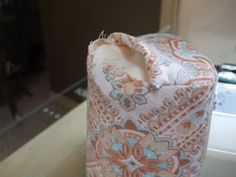 an orange and blue bag sitting on top of a counter