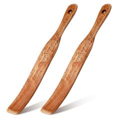 two wooden spoons sitting on top of each other