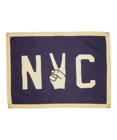 a purple and white flag with the letter n v c on it's side