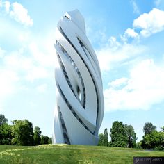 a tall white building sitting in the middle of a lush green field under a blue sky