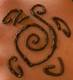 a woman's stomach with the word spa written on it and swirls in the middle