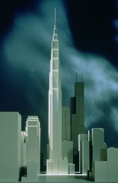 a model of a city with skyscrapers and clouds in the background at night time