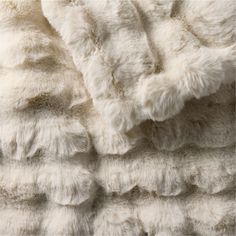 a white blanket that has been made out of fur