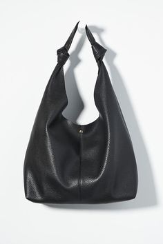 This oversized tote is your new BFF. Tied with two playful knots, this just-right sized, slouchy silhouette is designed to hold all your essentials (and more!) effortlessly – and with a touch of oh-so-fashionable flair. | The Love Knot Slouchy Bag by Anthropologie in Black, Women's, Polyurethane Slouchy Tote, Slouchy Bag, Hobo Tote Bag, Minimalist Accessories, Laptop Bag For Women, Black Leather Tote Bag, Faux Leather Bag, Oversized Tote, Black Leather Tote