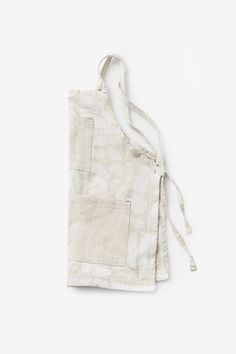 a white apron with an open pocket on it