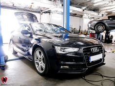 an audi car being worked on in a garage