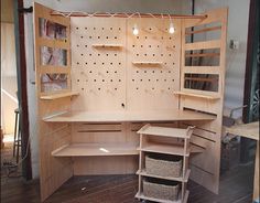 a wooden cabinet with shelves and baskets in it