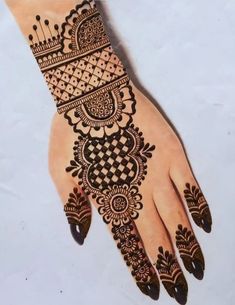 a henna tattoo on someone's hand