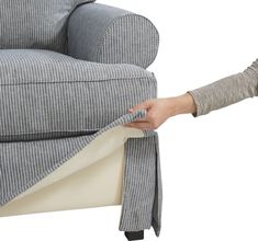 a person is pulling up the arm rest of a couch