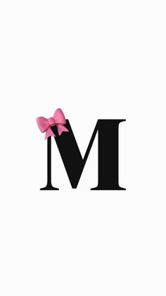 the letter m with a pink bow on it