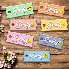 four tags with smiley faces on them and the words smile, embellishments