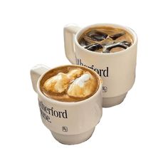 two mugs filled with hot chocolate and marshmallows on top of each other