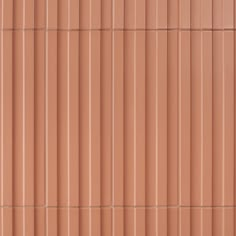 a brown wall with vertical lines on it