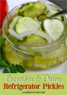 pickled cucumbers and onions in a jar on a plate next to a tomato